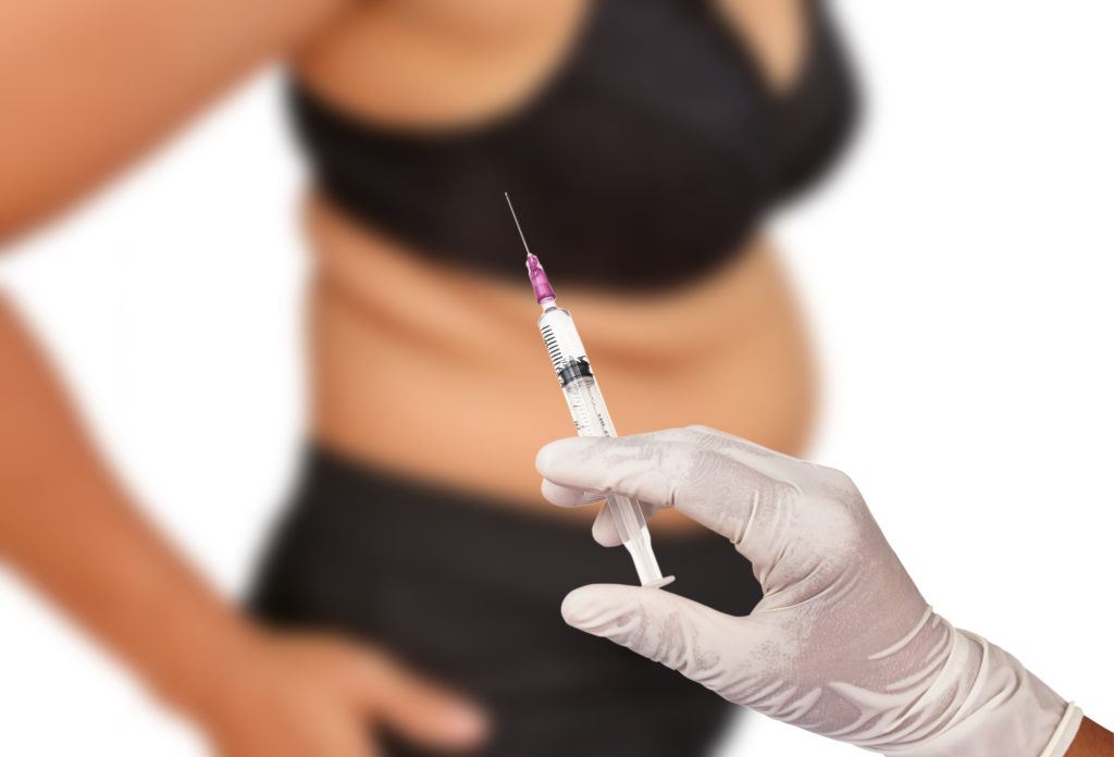 Woman getting HCG injection to help with weight loss